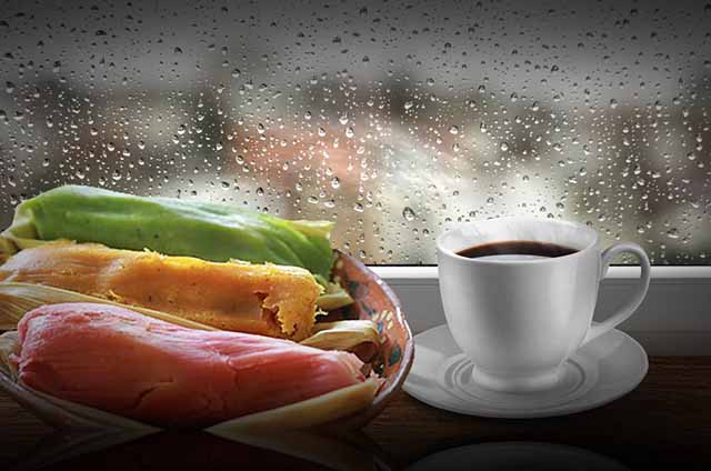 Coffee cup against window with rainy day view